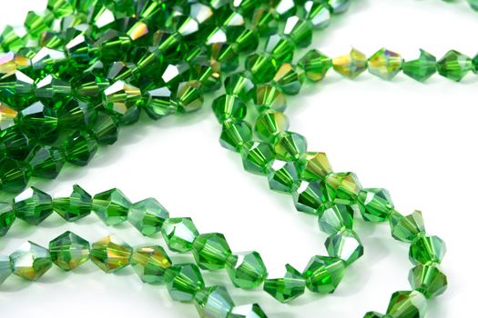 Beautiful Light green Glass Sparkle Crystal Isoalted Beads on white background. Use for diy beaded jewelry