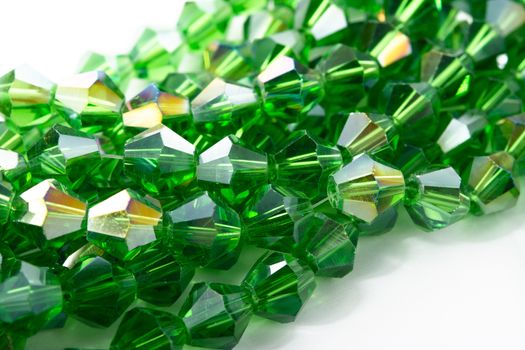 Beautiful Light green Glass Sparkle Crystal Isoalted Beads on white background. Use for diy beaded jewelry