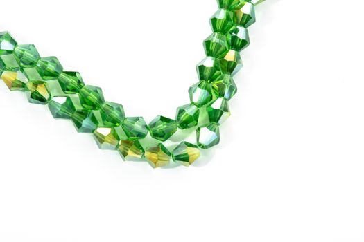 Beautiful Light green Glass Sparkle Crystal Isoalted Beads on white background. Use for diy beaded jewelry