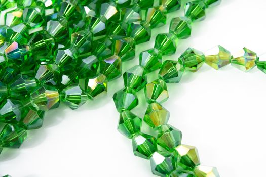 Beautiful Light green Glass Sparkle Crystal Isoalted Beads on white background. Use for diy beaded jewelry