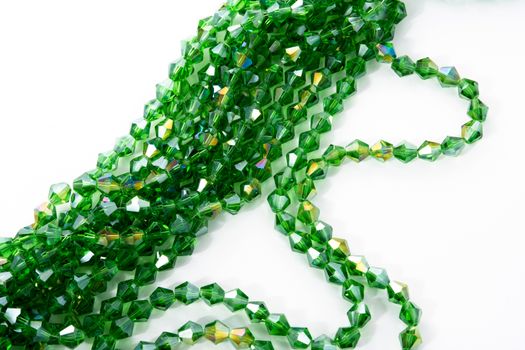 Beautiful Light green Glass Sparkle Crystal Isoalted Beads on white background. Use for diy beaded jewelry