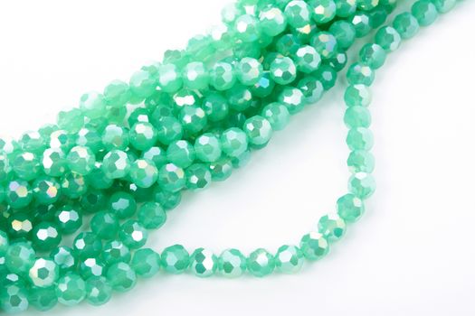 Beautiful Light green Glass Sparkle Crystal Isoalted Beads on white background. Use for diy beaded jewelry