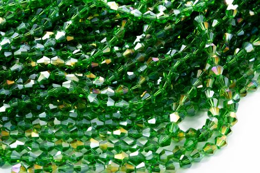 Beautiful Light green Glass Sparkle Crystal Isoalted Beads on white background. Use for diy beaded jewelry