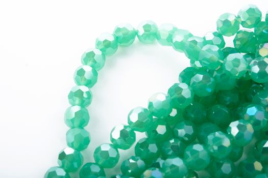 Beautiful Light green Glass Sparkle Crystal Isoalted Beads on white background. Use for diy beaded jewelry