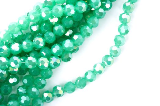 Beautiful Light green Glass Sparkle Crystal Isoalted Beads on white background. Use for diy beaded jewelry