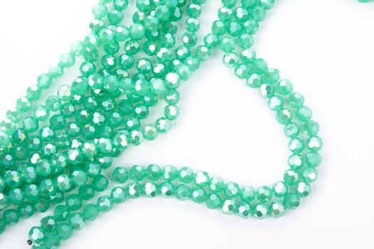 Beautiful Light green Glass Sparkle Crystal Isoalted Beads on white background. Use for diy beaded jewelry