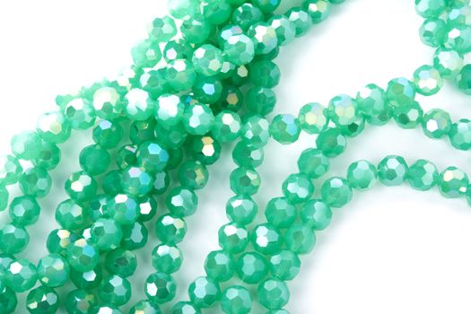 Beautiful Light green Glass Sparkle Crystal Isoalted Beads on white background. Use for diy beaded jewelry