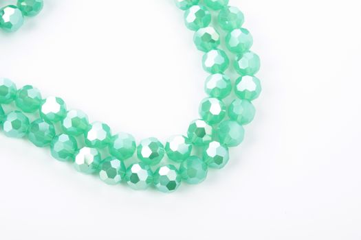 Beautiful Light green Glass Sparkle Crystal Isoalted Beads on white background. Use for diy beaded jewelry