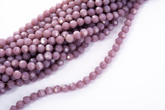 Beautiful Light purple Glass Sparkle Crystal Isoalted Beads on white background. Use for diy beaded jewelry