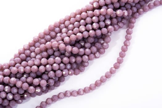 Beautiful Light purple Glass Sparkle Crystal Isoalted Beads on white background. Use for diy beaded jewelry