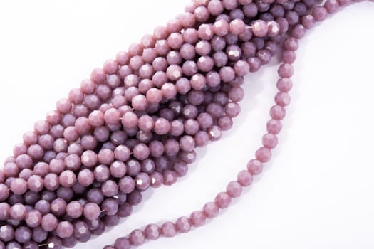 Beautiful Light purple Glass Sparkle Crystal Isoalted Beads on white background. Use for diy beaded jewelry