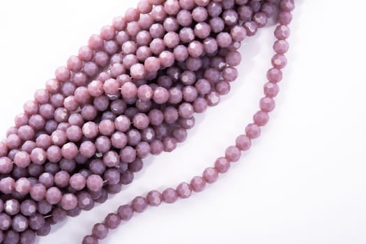 Beautiful Light purple Glass Sparkle Crystal Isoalted Beads on white background. Use for diy beaded jewelry