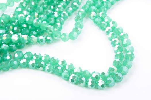 Beautiful Light green Glass Sparkle Crystal Isoalted Beads on white background. Use for diy beaded jewelry