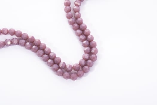 Beautiful Light purple Glass Sparkle Crystal Isoalted Beads on white background. Use for diy beaded jewelry