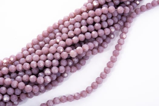 Beautiful Light purple Glass Sparkle Crystal Isoalted Beads on white background. Use for diy beaded jewelry