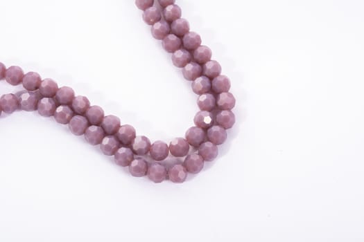 Beautiful Light purple Glass Sparkle Crystal Isoalted Beads on white background. Use for diy beaded jewelry