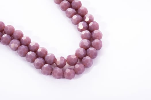 Beautiful Light purple Glass Sparkle Crystal Isoalted Beads on white background. Use for diy beaded jewelry