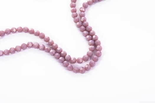 Beautiful Light purple Glass Sparkle Crystal Isoalted Beads on white background. Use for diy beaded jewelry