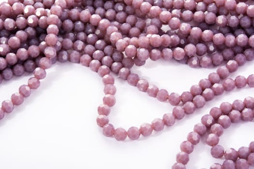 Beautiful Light purple Glass Sparkle Crystal Isoalted Beads on white background. Use for diy beaded jewelry