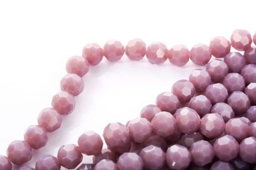 Beautiful Light purple Glass Sparkle Crystal Isoalted Beads on white background. Use for diy beaded jewelry