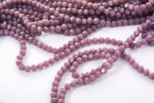 Beautiful Light purple Glass Sparkle Crystal Isoalted Beads on white background. Use for diy beaded jewelry