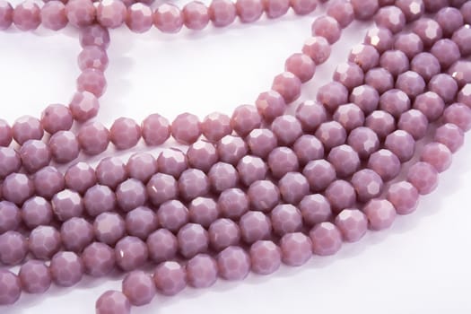 Beautiful Light purple Glass Sparkle Crystal Isoalted Beads on white background. Use for diy beaded jewelry