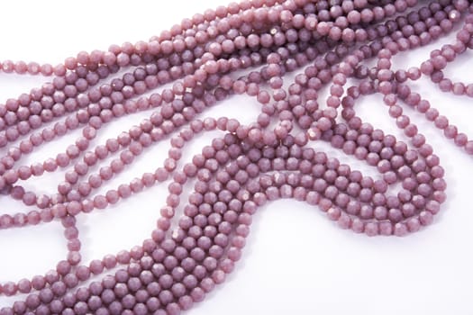 Beautiful Light purple Glass Sparkle Crystal Isoalted Beads on white background. Use for diy beaded jewelry