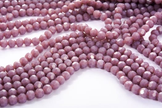 Beautiful Light purple Glass Sparkle Crystal Isoalted Beads on white background. Use for diy beaded jewelry