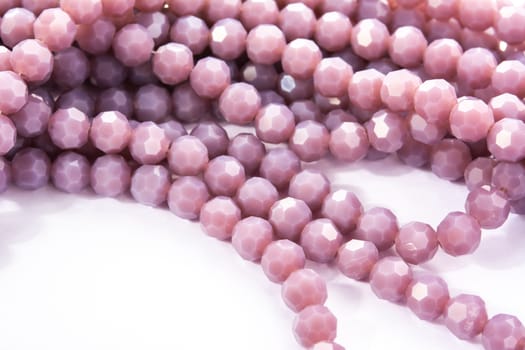 Beautiful Light purple Glass Sparkle Crystal Isoalted Beads on white background. Use for diy beaded jewelry