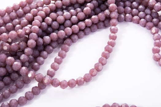 Beautiful Light purple Glass Sparkle Crystal Isoalted Beads on white background. Use for diy beaded jewelry