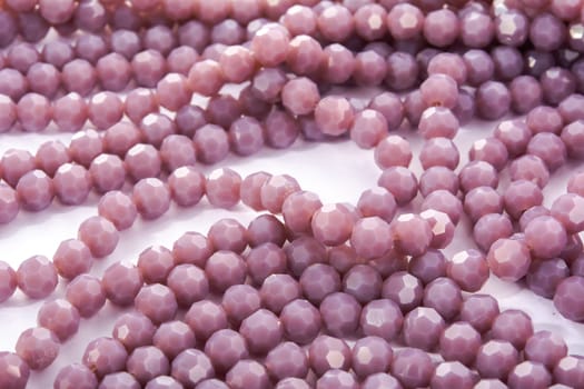 Beautiful Light purple Glass Sparkle Crystal Isoalted Beads on white background. Use for diy beaded jewelry