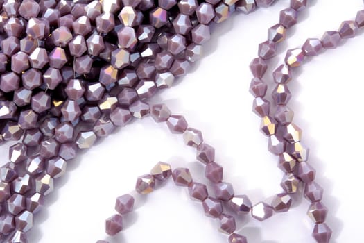 Beautiful Light purple Glass Sparkle Crystal Isoalted Beads on white background. Use for diy beaded jewelry