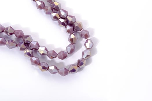 Beautiful Light purple Glass Sparkle Crystal Isoalted Beads on white background. Use for diy beaded jewelry