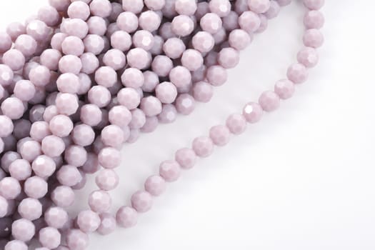 Beautiful Light purple Glass Sparkle Crystal Isoalted Beads on white background. Use for diy beaded jewelry