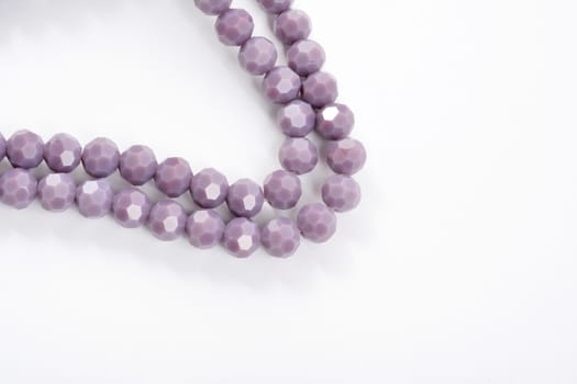 Beautiful Light purple Glass Sparkle Crystal Isoalted Beads on white background. Use for diy beaded jewelry
