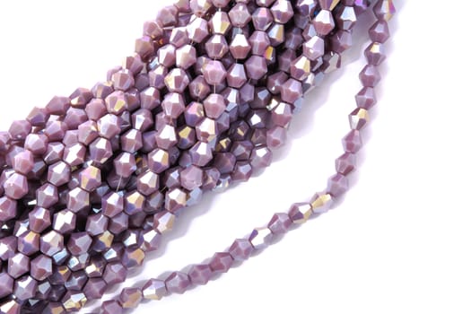Beautiful Light purple Glass Sparkle Crystal Isoalted Beads on white background. Use for diy beaded jewelry