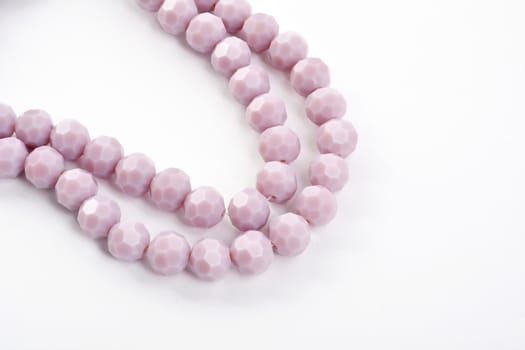Beautiful Light purple Glass Sparkle Crystal Isoalted Beads on white background. Use for diy beaded jewelry