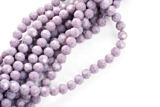Beautiful Light purple Glass Sparkle Crystal Isoalted Beads on white background. Use for diy beaded jewelry
