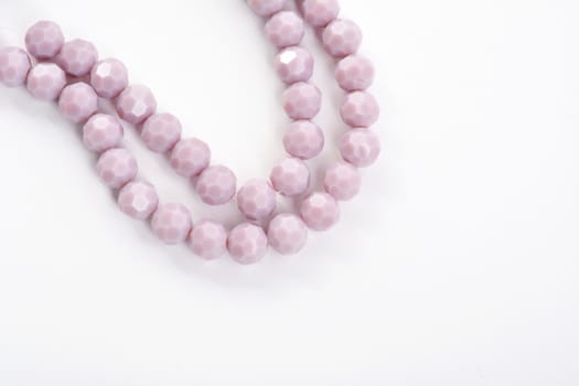Beautiful Light purple Glass Sparkle Crystal Isoalted Beads on white background. Use for diy beaded jewelry