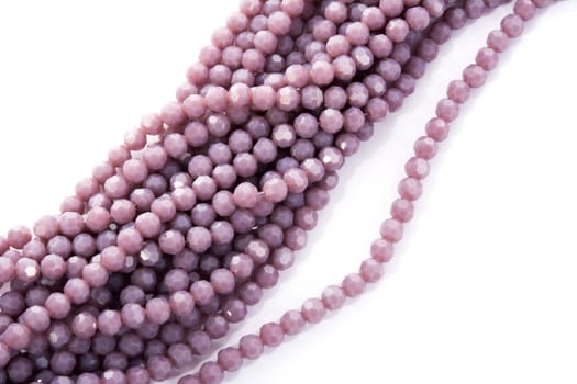 Beautiful Light purple Glass Sparkle Crystal Isoalted Beads on white background. Use for diy beaded jewelry