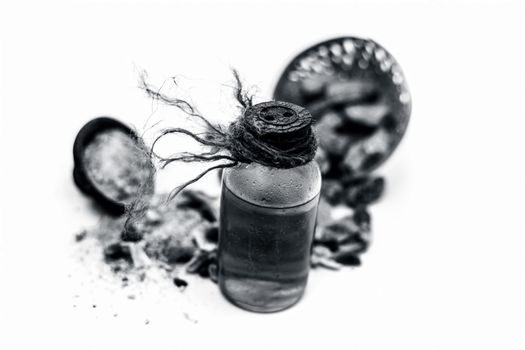 Raw organic dried dates in a hamper with its extracted oil and its powder in a clay bowl isolated on white which widely used in flavored beverages almost entire Asia.