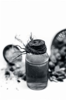 Raw organic dried dates in a hamper with its extracted oil and its powder in a clay bowl isolated on white which widely used in flavored beverages almost entire Asia.