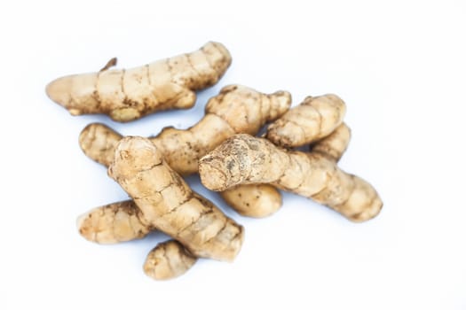 Close up of raw fresh organic ginger isolated on white also knwon as adrak or Zingiber officinale.