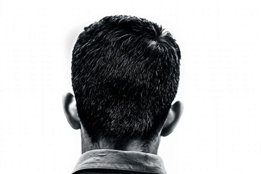 Backside shot of a young teenager affected by premature Grey isolated on white.