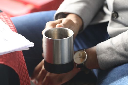 Male hand with cup