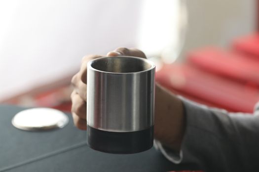 Male hand with cup