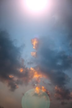 Clouds with sun flair shot taken at the time of sunset.