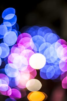 Colorful Christmas lights and blurred background or bookeh of them.