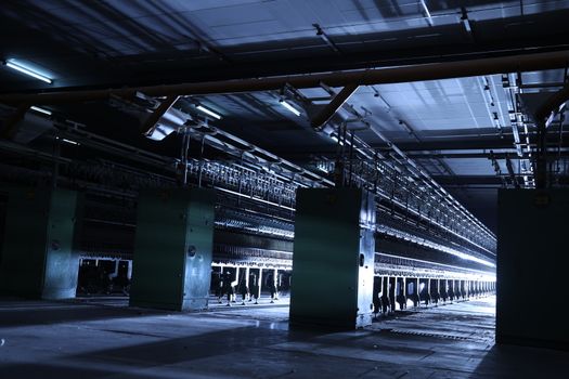 Old machine inside textile factory