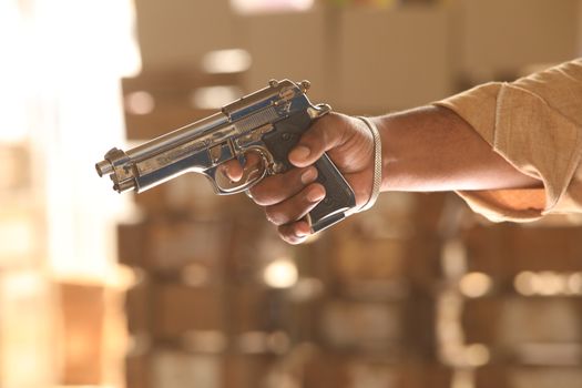 closeup of Revolver in man hand